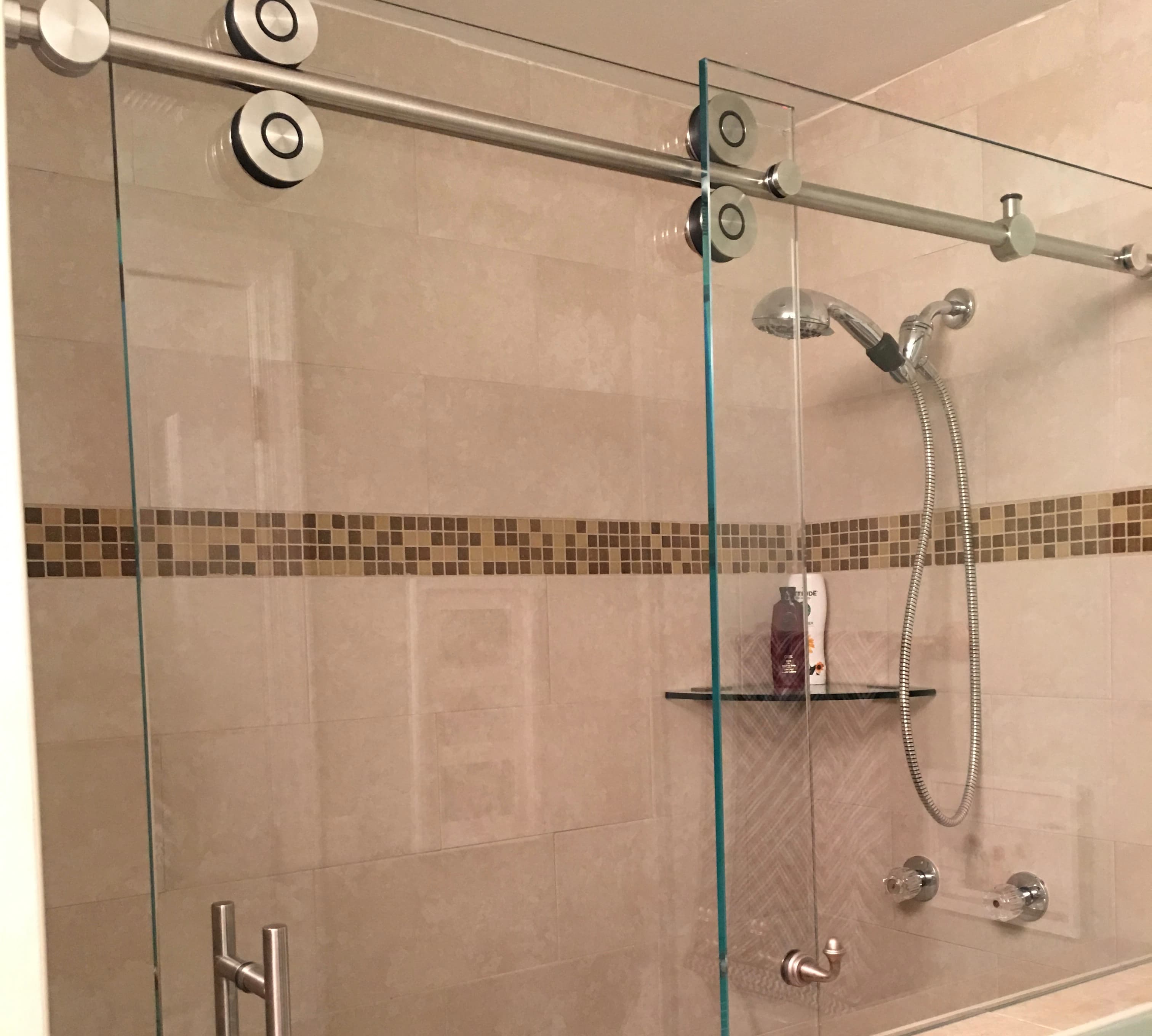 Custom shower enclosure with coordinated hardware