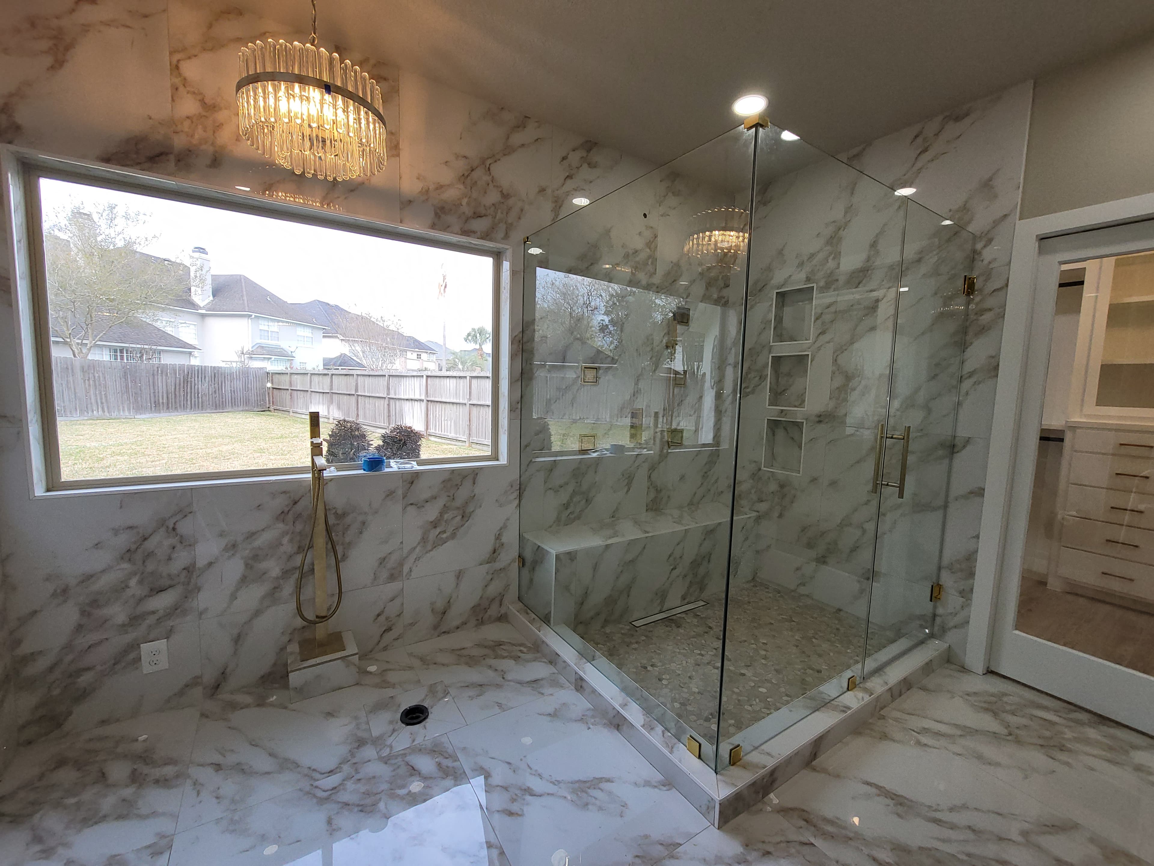 Frameless shower enclosure in finished bathroom